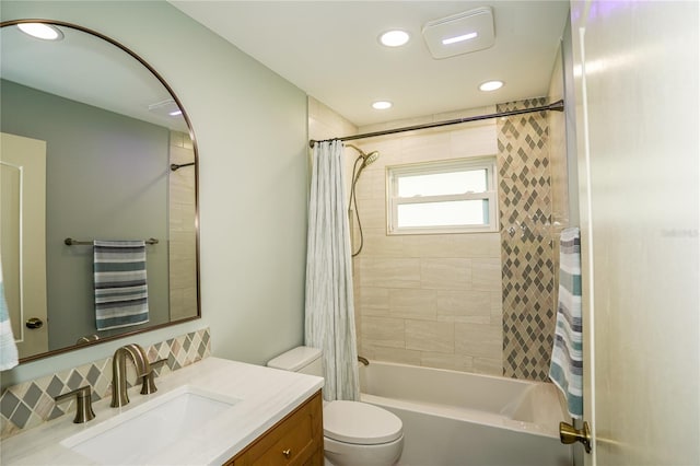 full bathroom featuring shower / tub combo, vanity, and toilet