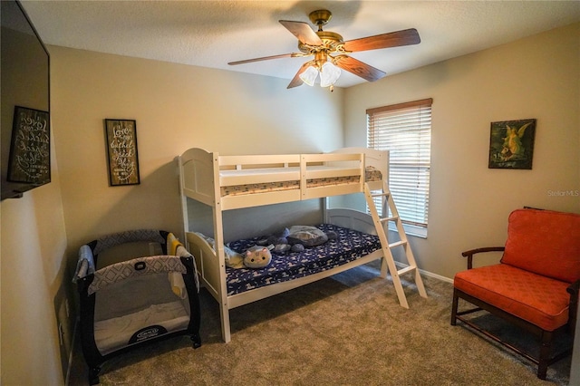 bedroom featuring ceiling fan and carpet floors