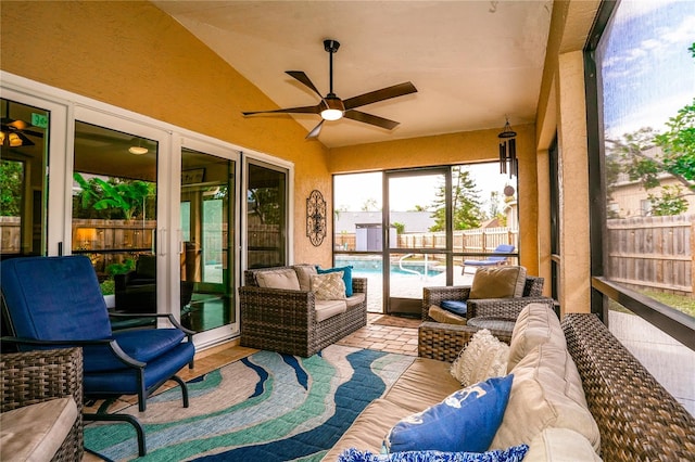 sunroom / solarium featuring vaulted ceiling and ceiling fan