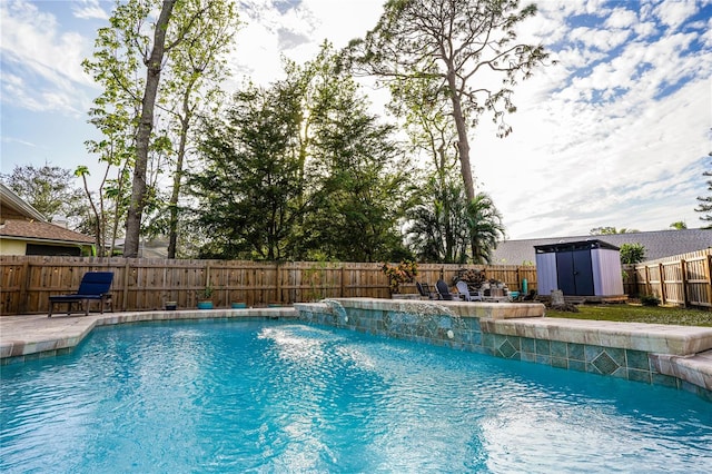 view of pool featuring pool water feature and a storage shed