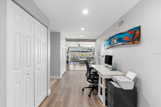 office area featuring light hardwood / wood-style flooring and ceiling fan