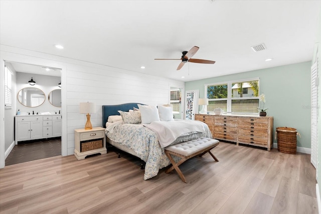 bedroom featuring ceiling fan and light hardwood / wood-style flooring