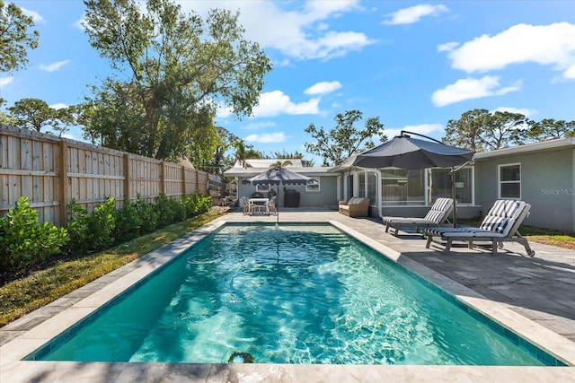 view of pool featuring a patio area