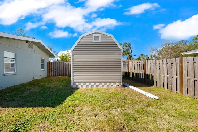 view of outdoor structure featuring a lawn