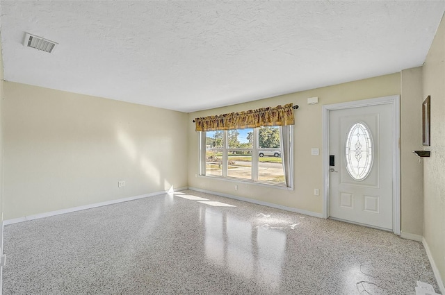 entrance foyer with a textured ceiling