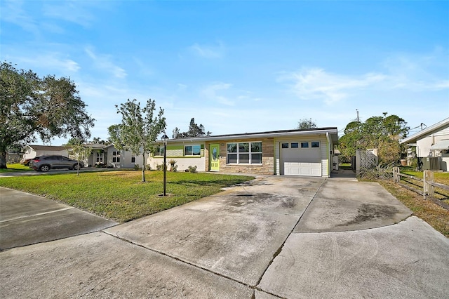 view of front facade featuring a garage and a front lawn