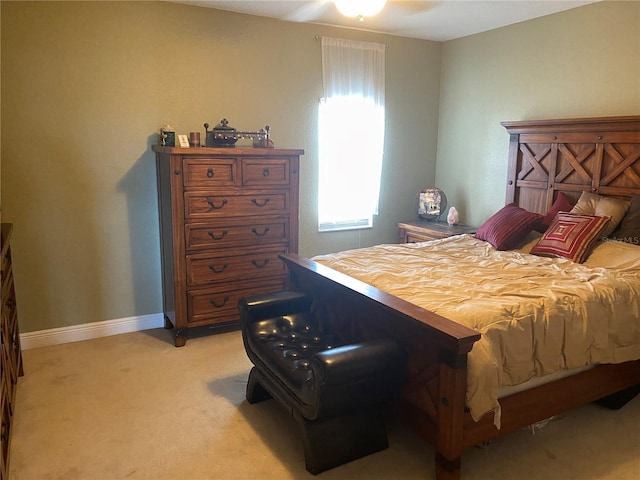 bedroom with light carpet