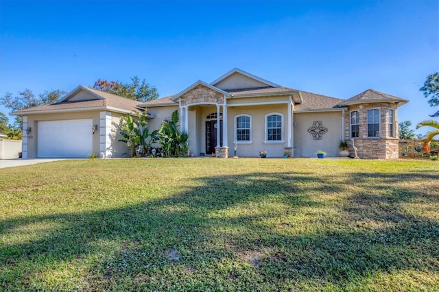 single story home with a garage and a front yard