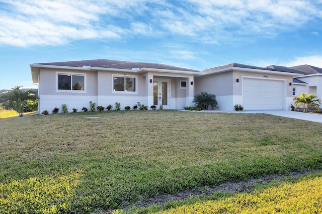 view of front of house with a front yard and a garage