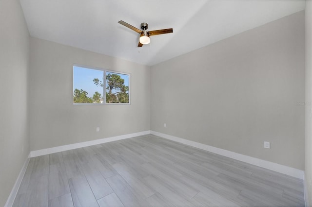 empty room with ceiling fan and light wood-type flooring