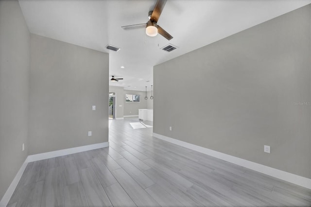 unfurnished room with ceiling fan and light hardwood / wood-style flooring