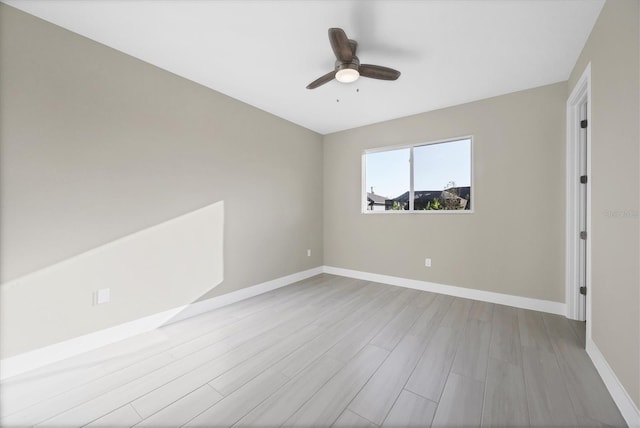 unfurnished room featuring ceiling fan and light wood-type flooring