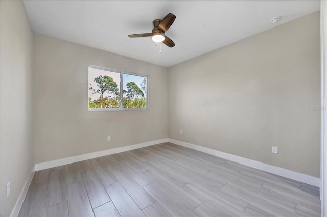 unfurnished room featuring ceiling fan and light wood-type flooring