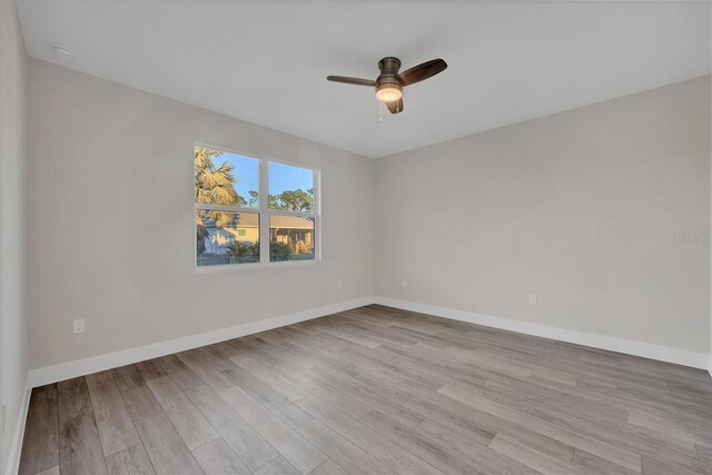 unfurnished room with ceiling fan and light hardwood / wood-style flooring