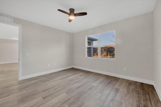 empty room with light hardwood / wood-style floors and ceiling fan