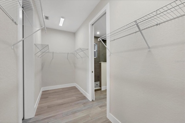 walk in closet featuring light wood-type flooring