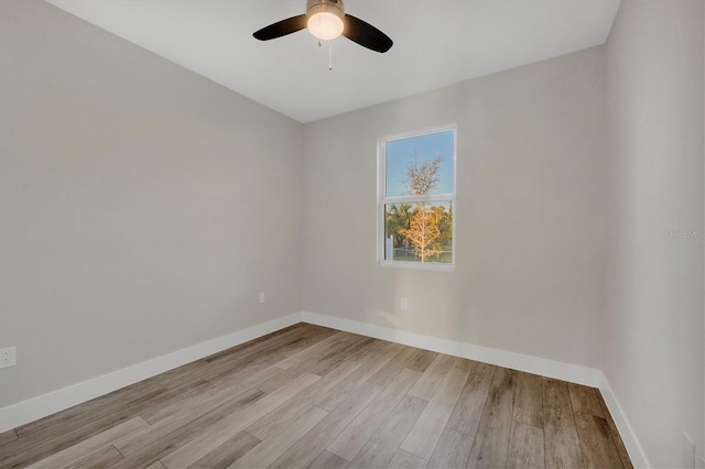 spare room with light wood-type flooring and ceiling fan