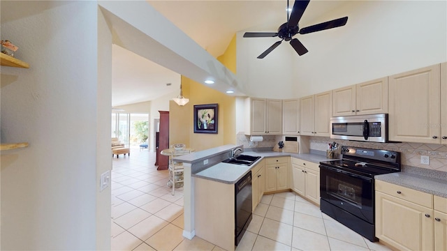 kitchen featuring black appliances, sink, light tile patterned floors, decorative light fixtures, and kitchen peninsula