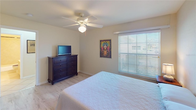 tiled bedroom with ceiling fan