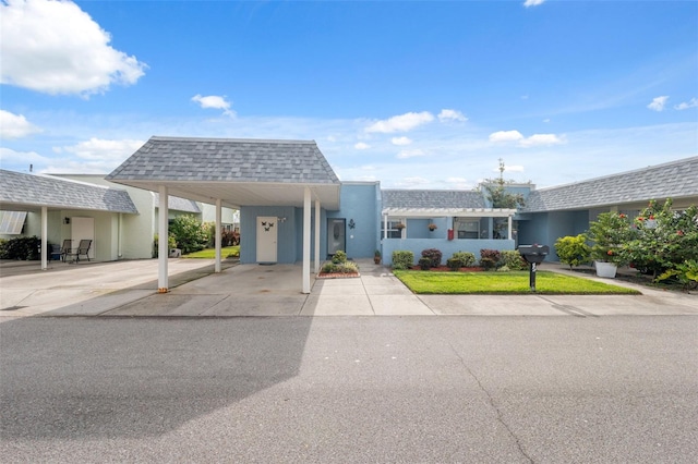 view of front of home with a carport