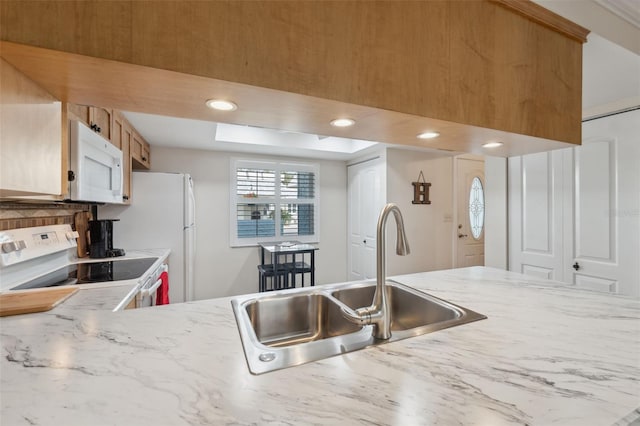 kitchen with white appliances and sink