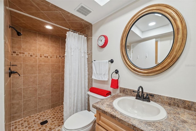 bathroom with vanity, curtained shower, and toilet