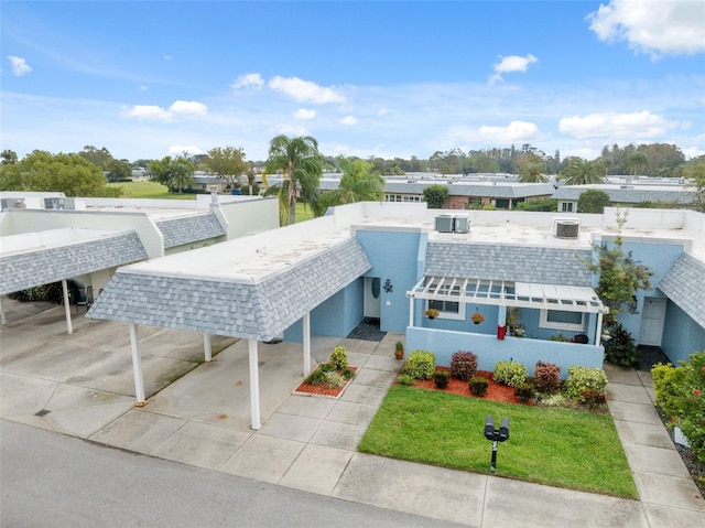 view of front of property with a carport