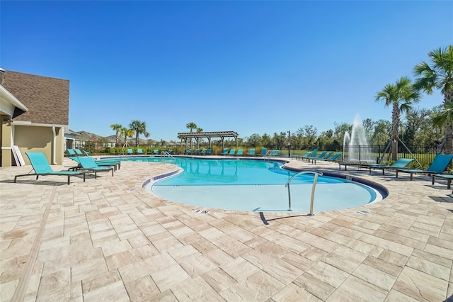 view of swimming pool with a patio area