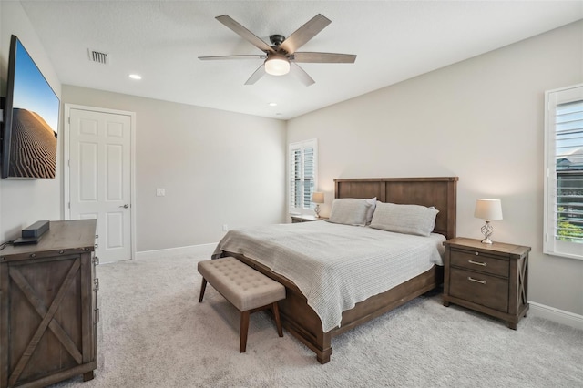 bedroom featuring light carpet and ceiling fan