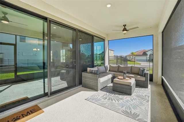 sunroom with ceiling fan