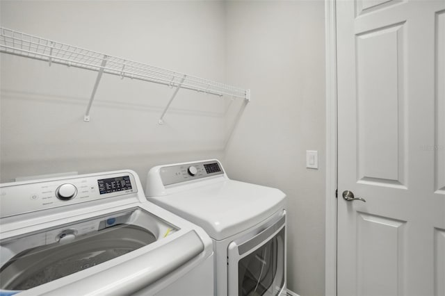 laundry room featuring separate washer and dryer