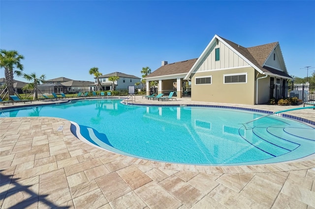 view of swimming pool with a patio area