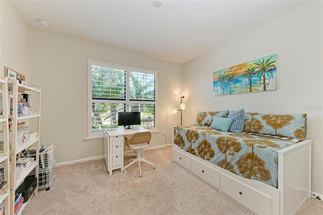 bedroom featuring light colored carpet