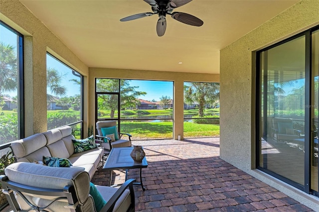 sunroom / solarium with ceiling fan