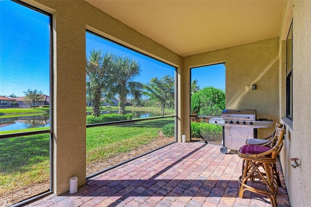 sunroom with a water view