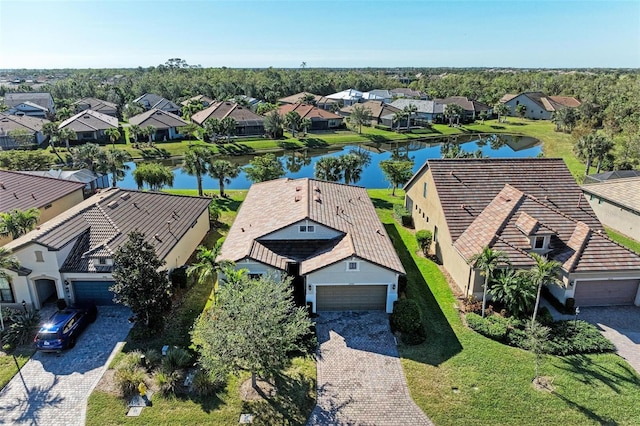 birds eye view of property with a water view