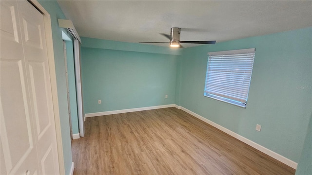 unfurnished bedroom featuring ceiling fan and light wood-type flooring