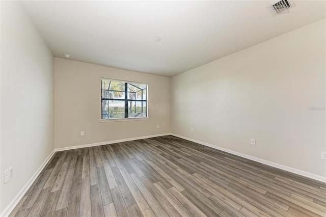 spare room featuring hardwood / wood-style floors