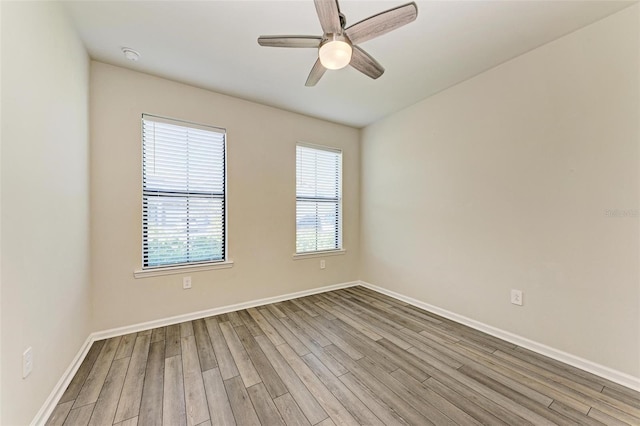 unfurnished room featuring ceiling fan and light hardwood / wood-style floors