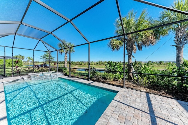 view of swimming pool with glass enclosure and an in ground hot tub