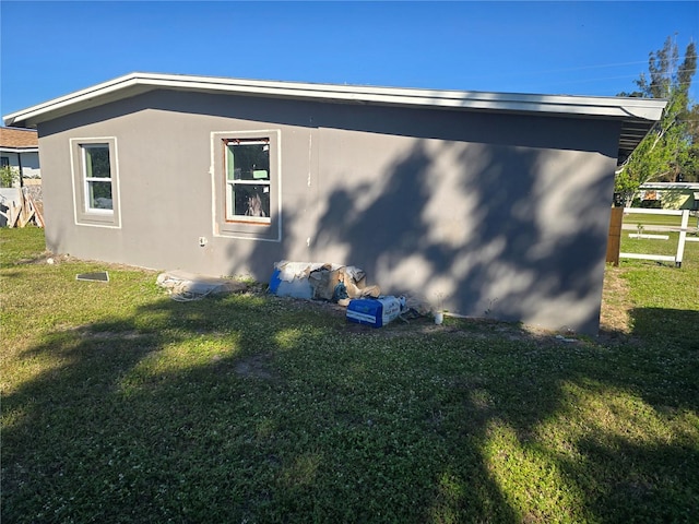 view of home's exterior featuring a lawn