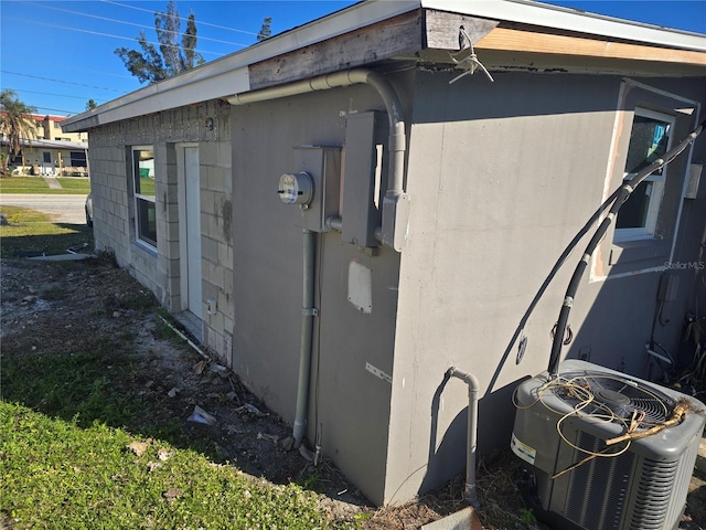 view of home's exterior with cooling unit