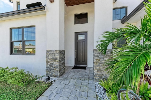 901 30th Ct E, Bradenton, FL 34208 - doorway to property with stone siding and stucco siding