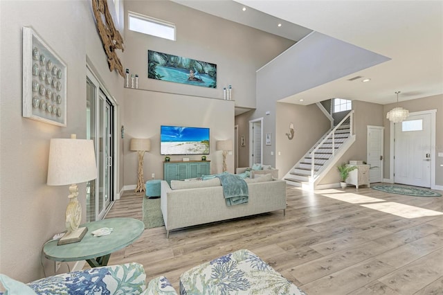 901 30th Ct E, Bradenton, FL 34208 - living area with wood finished floors, stairs, a high ceiling, and recessed lighting