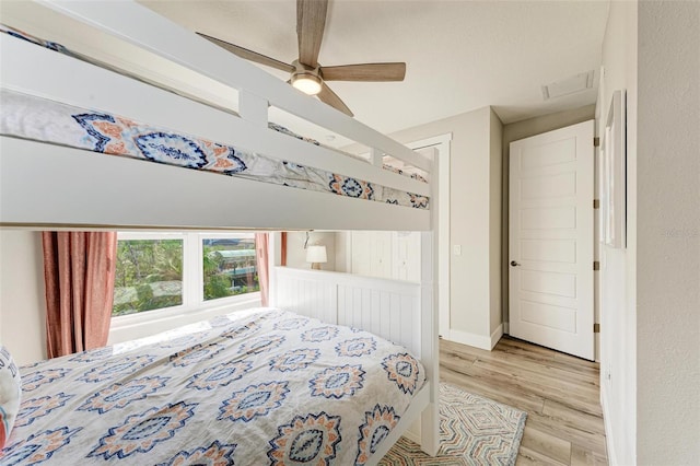 bedroom featuring light hardwood / wood-style flooring and ceiling fan