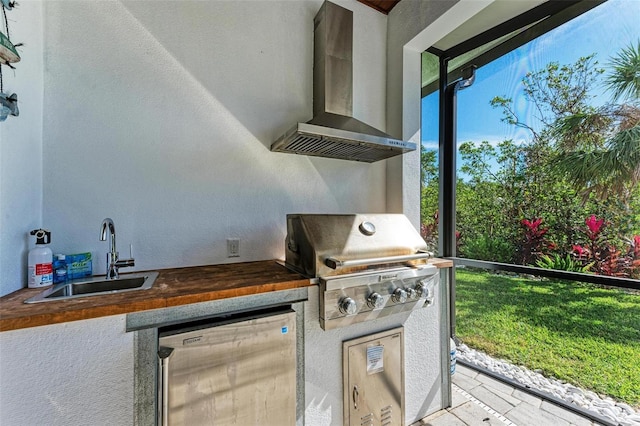 view of patio / terrace with area for grilling and sink