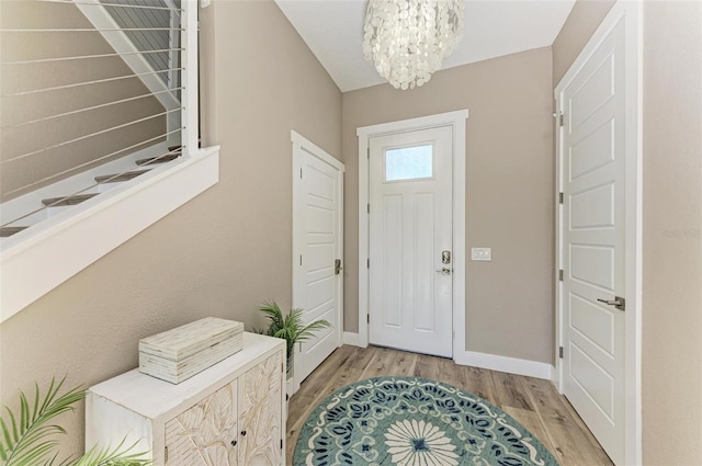901 30th Ct E, Bradenton, FL 34208 - entryway featuring light wood-style flooring and a chandelier