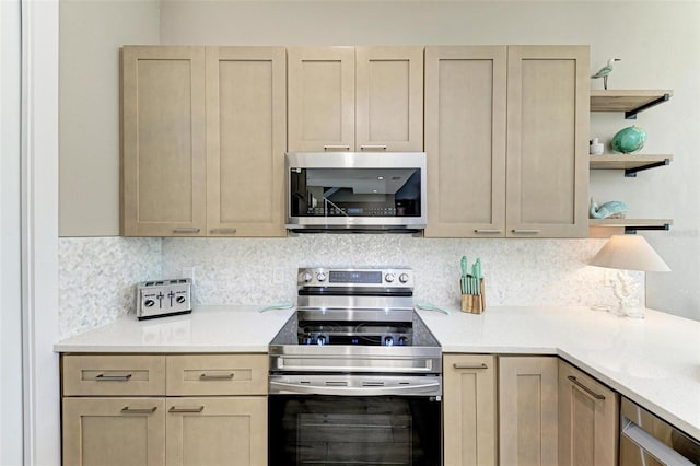 901 30th Ct E, Bradenton, FL 34208 - kitchen with appliances with stainless steel finishes, open shelves, light countertops, and light brown cabinets