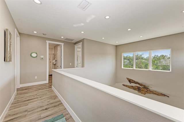 901 30th Ct E, Bradenton, FL 34208 - hallway with light wood-style floors, recessed lighting, and an upstairs landing