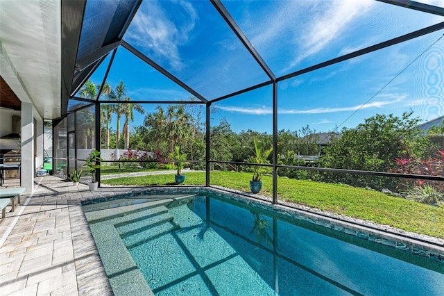 view of swimming pool featuring a lanai and a patio